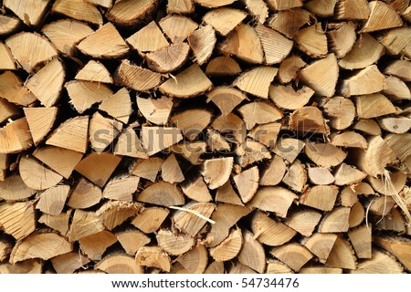 A close up view of a pile of stacked firewood