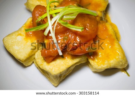 Deep fried tofu in tomato and pepper sauce