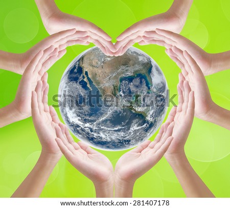 Hand heart shape on earth background , concept design  , Elements of image are furnished by NASA