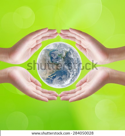 Hands holding earth  on green bokeh background , concept design , Elements of image are furnished by NASA