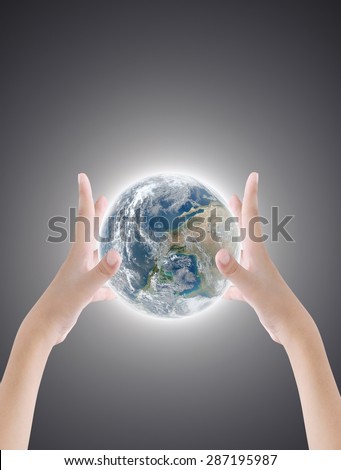 Hand holding earth on dark light background ,concept background , Elements of image are furnished by NASA