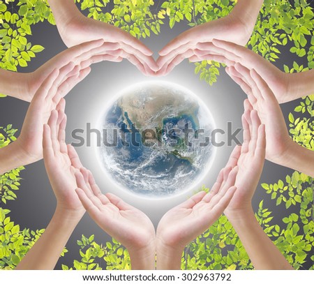 Hand heart shape and earth on dark background , concept design , Elements of image are furnished by NASA