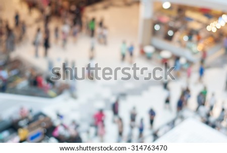 Blurred many people in shopping mall for background
