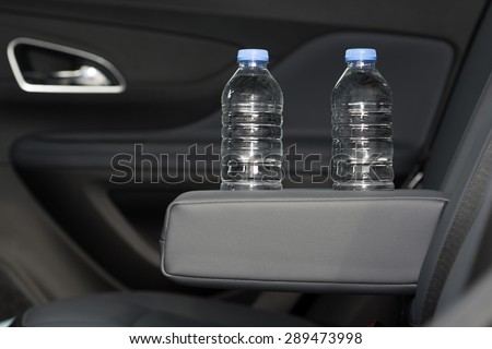 cup holder for water bottle, Modern Car Interior Top View. Black Leather Brand New Car Interior