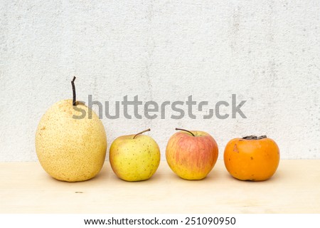 fruit group still life on plywood and concrete wall