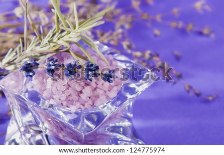 Bunch of dried lavender herb and lavender flowers in a bowl
