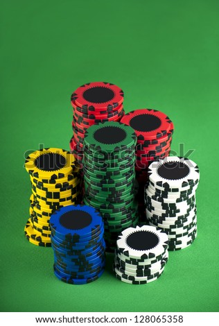 poker chips on a green table background
