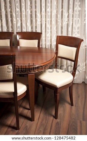 Contemporary dining room, a table with chairs in the foreground