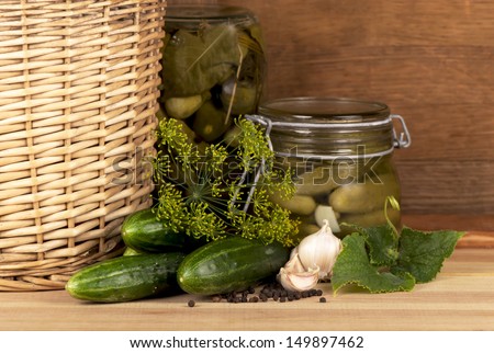 Gherkins. Pickles. Salted Cucumbers still-life on  wooden background