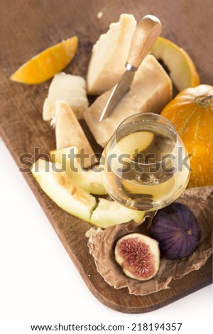 fig, cheese, melon and white dry wine