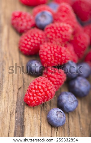 Berries on Wooden Background. Summer or Spring Organic Berry over Wood