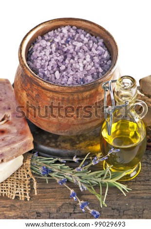 Dry lavender, oils, salt, handwork soap on a wooden board
