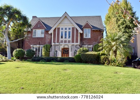 Upper-class luxury home with intricate stonework and brick.LA, California.