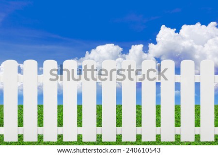 White fence on green grass and cloud, Copy space.