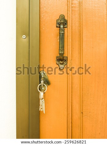 Entrance sliding door with key.