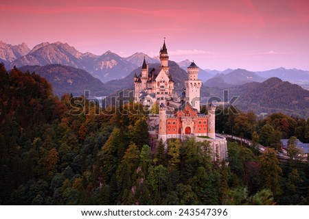 Beautiful evening view of the Neuschwanstein castle, with autumn colours after sunset, Bavarian Alps, Bavaria, Germany