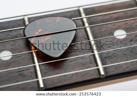 Guitar frets with strings and mediator