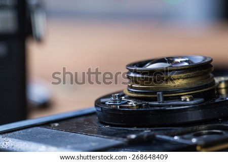 Disassembled broken film camera