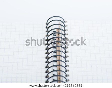 A spiral notebook over the white background