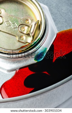 Steel oil and chemical drum over the white background with red pollution liquid, isolated
