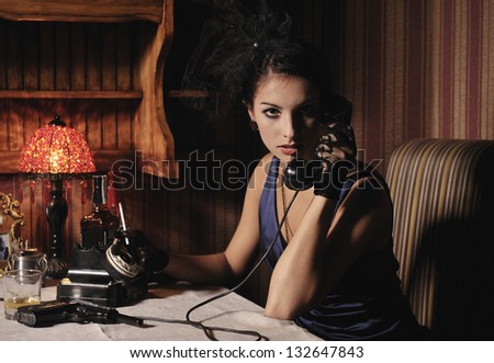 Woman portrait  in retro style with phone and cigarette.