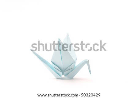 Origami bird over white. Child paper articles.