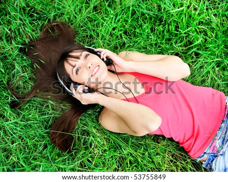 Pretty young girl listening music