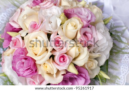 Wedding bouquet of pink roses, soft focus.
