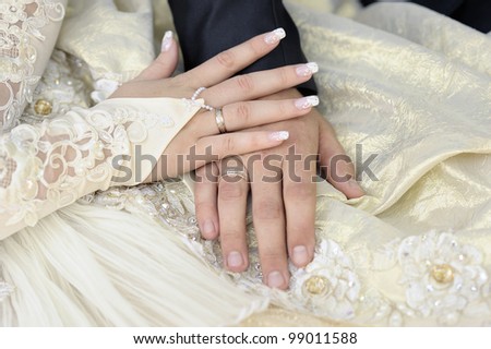 Just married couple hands. Focus on a bride hand.