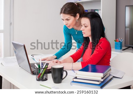 Students work on a laptop
