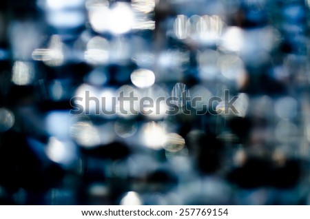 stock photo blur light from glass in low light place colorful with white blue and black shade