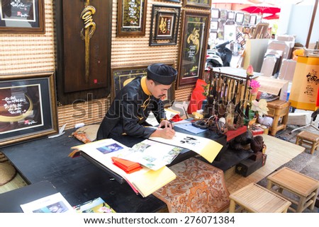 Ho Chi Minh City, Vietnam - January 20, 2014: Scholars Vietnamese Lunar Year festival in calligraphy held at the Youth Cultural House. This is a tradition of the Vietnamese lunar new year