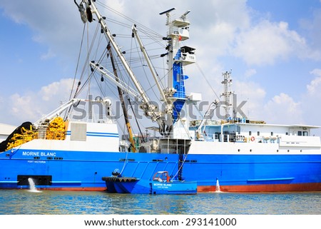 Hochiminh City, Vietnam - June 27, 2015: Transportation for export, at Cat Lai port import on Sai Gon river, boat crane to load containers, this is big harbor for trade service industry, Vietnam
