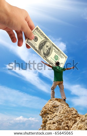 Man on peak of mountain and hand with money. Money conception design.