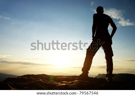 Silhouette of man in mountain. Conceptual scene.