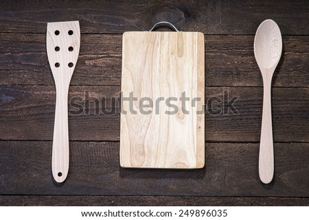 Wooden kitchenware and cutting board on the wood table