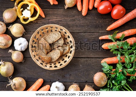 Cutted bread with fresh vegetables mix on the table