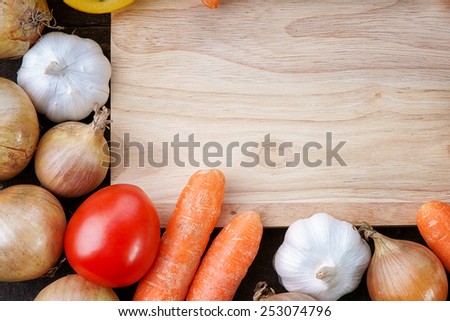 Wooden cutting board with healthy vegetables