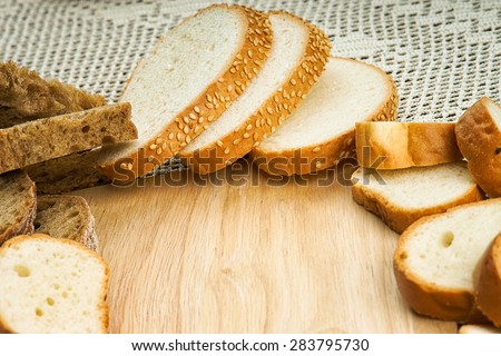 Wood cutting board among handmade bread