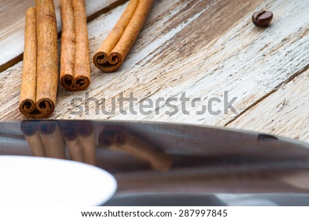 Coffee beans, cinnamon and vinyl plate