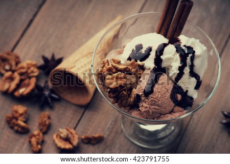 Ice cream sundae, waffle cone and walnuts