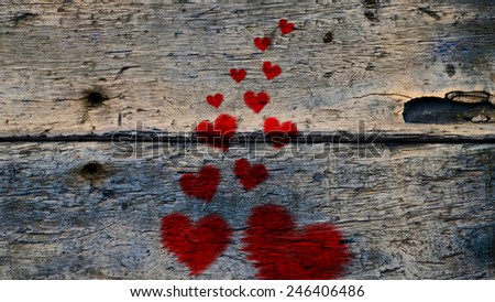 Red Heart shape on wood texture. background old panels