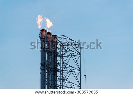 Flame burning on top of flare stack