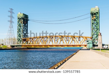 The Burlington Canal Lift Bridge is located on the western shore of Lake Ontario. The bridge spans the Burlington Canal that was opened in 1826.