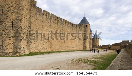 Carcassonne, France - November 2: Tourists in the medieval city of Carcassonne, France on November 2, 2013. Carcassonne medieval city is UNESCO World Heritage Site.