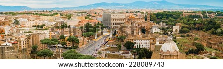 Rome, Italy - September 2, 2014: Panoramic view of the city of Rome. Tourists walking towards Coliseum in Rome on Septemberv 2, 2014