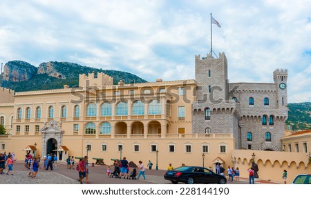Monaco ville, Monaco - September 5, 2014: Tourists passing by front of Prince\'s Palace of Monaco. Prince\'s Palace of Monaco is official residence of Prince of Monaco. Built in 1191 as fortress.