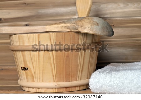 sauna bucket crossed over sauna bucket in a wooden cabin