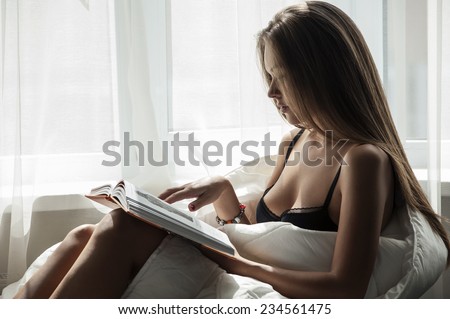 Fashion young woman. Portrait with elegant, pretty, beautiful girl with perfect skin she read the magazine or book at morning .