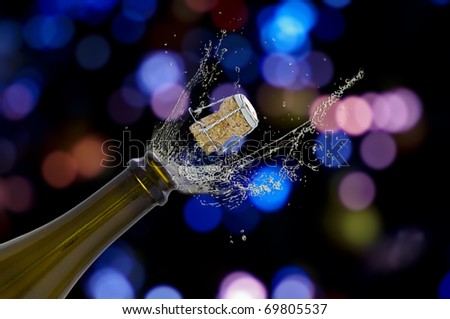 Open champagne bottle with an amazing light background